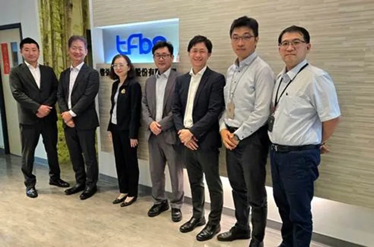 Group photo of representatives from both companies